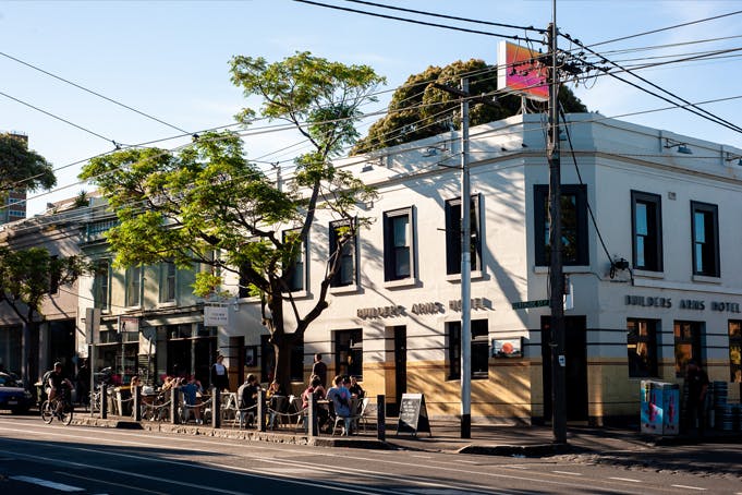 A corner pub with blue skies behind it.